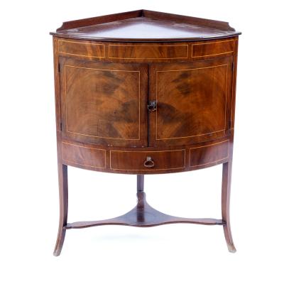 Appraisal: A George III mahogany bow-fronted corner washstand circa strung with