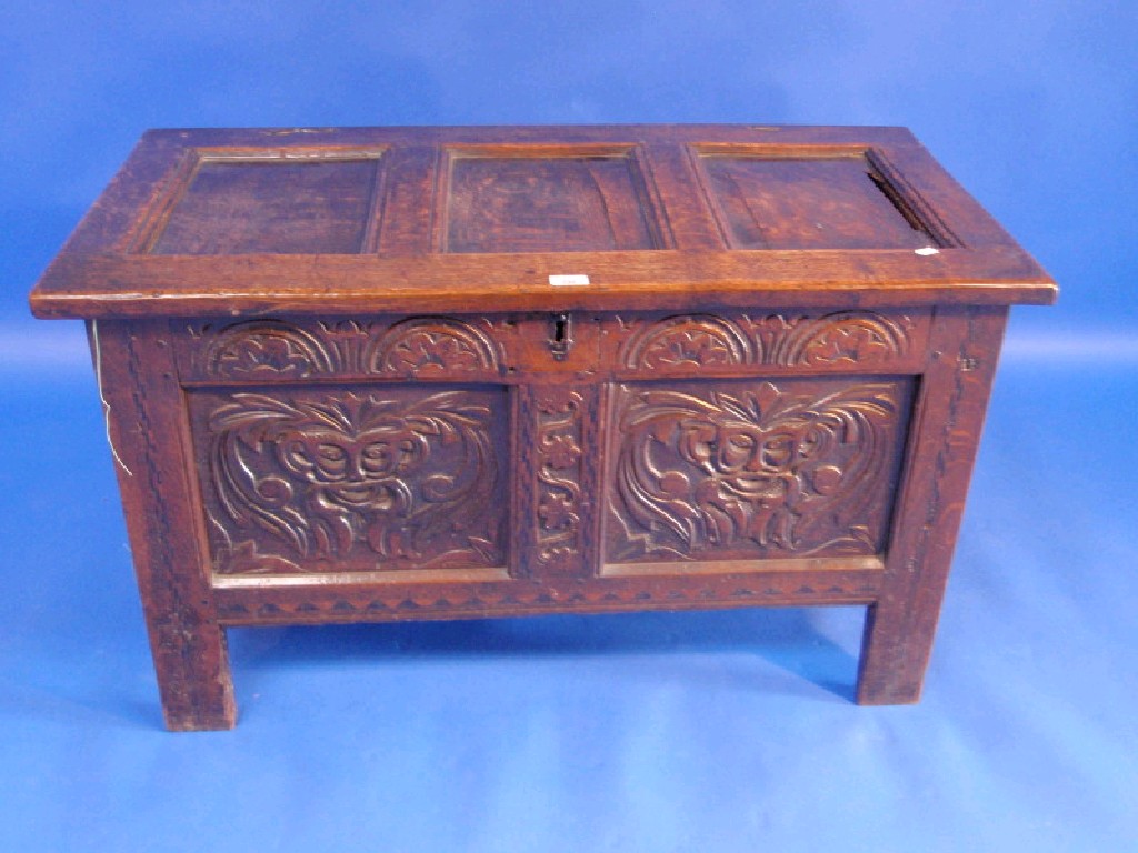 Appraisal: A thC oak coffer with three plain panels to the