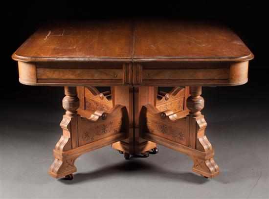 Appraisal: Victorian Eastlake style walnut square dining table with four extension