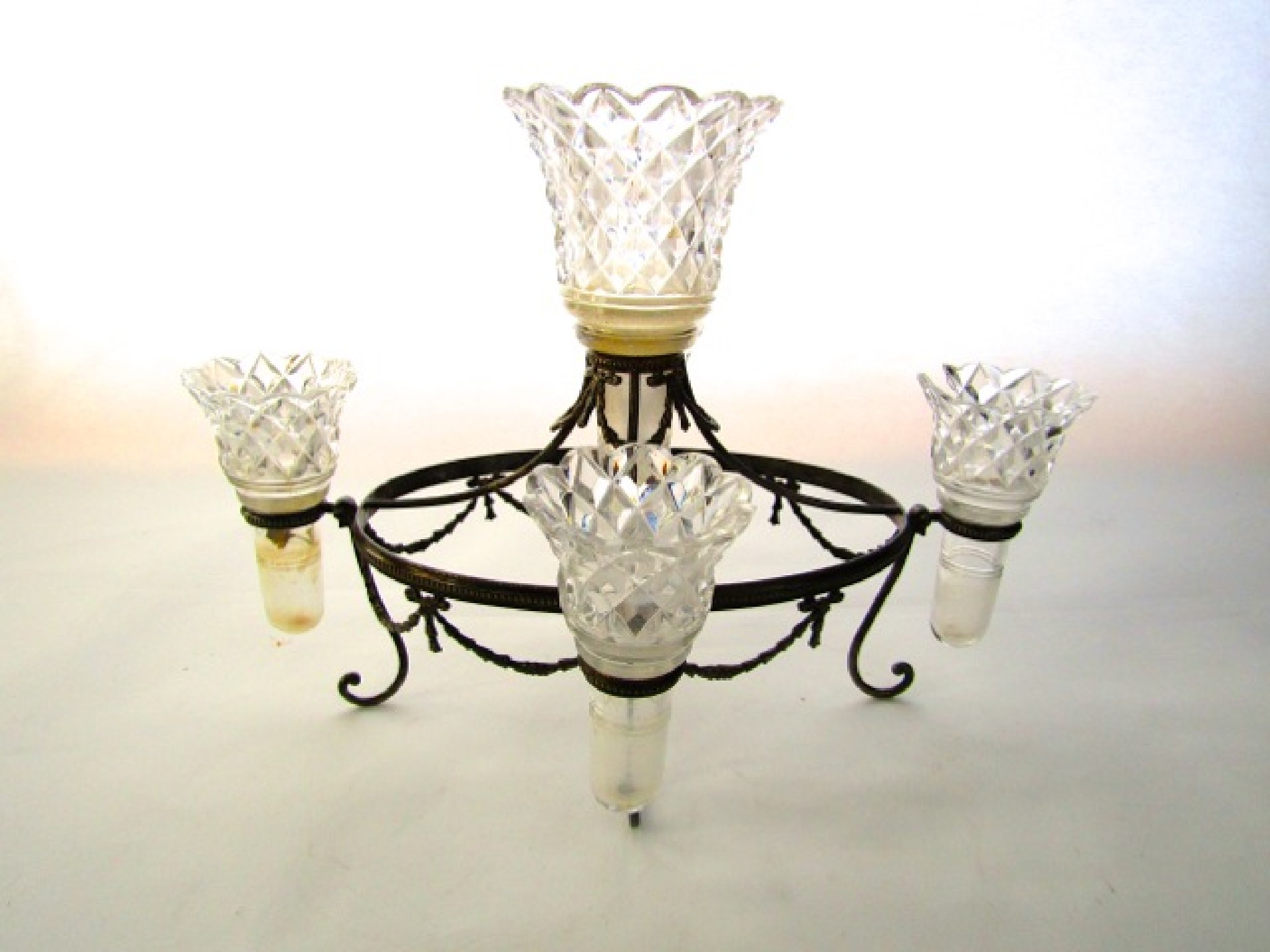 Appraisal: A silver plated table centrepiece with scrolling supports and oval