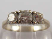 Appraisal: A white metal tests carat gold diamond three stone ring