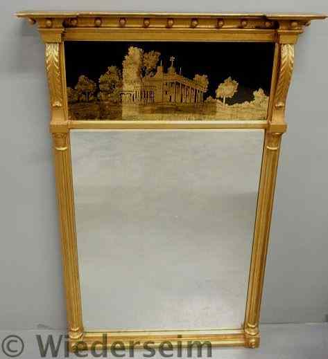 Appraisal: Sheraton style gilt decorated mirror with reverse painted glass panel