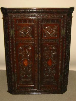 Appraisal: A GEORGE III OAK CORNER CUPBOARD late th century later