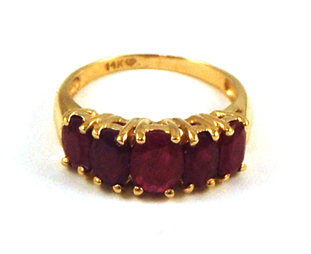 Appraisal: RUBY AND FOURTEEN KARAT GOLD RING set with five oval-cut