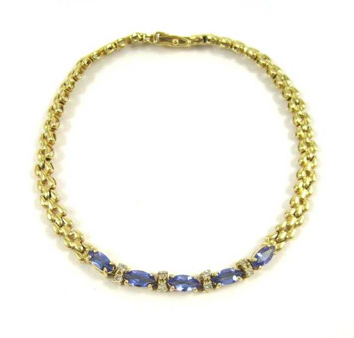 Appraisal: TANZANITE AND FOURTEEN KARAT GOLD BRACELET measuring - inches in