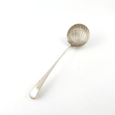 Appraisal: A George III silver soup ladle by Thomas Barker London