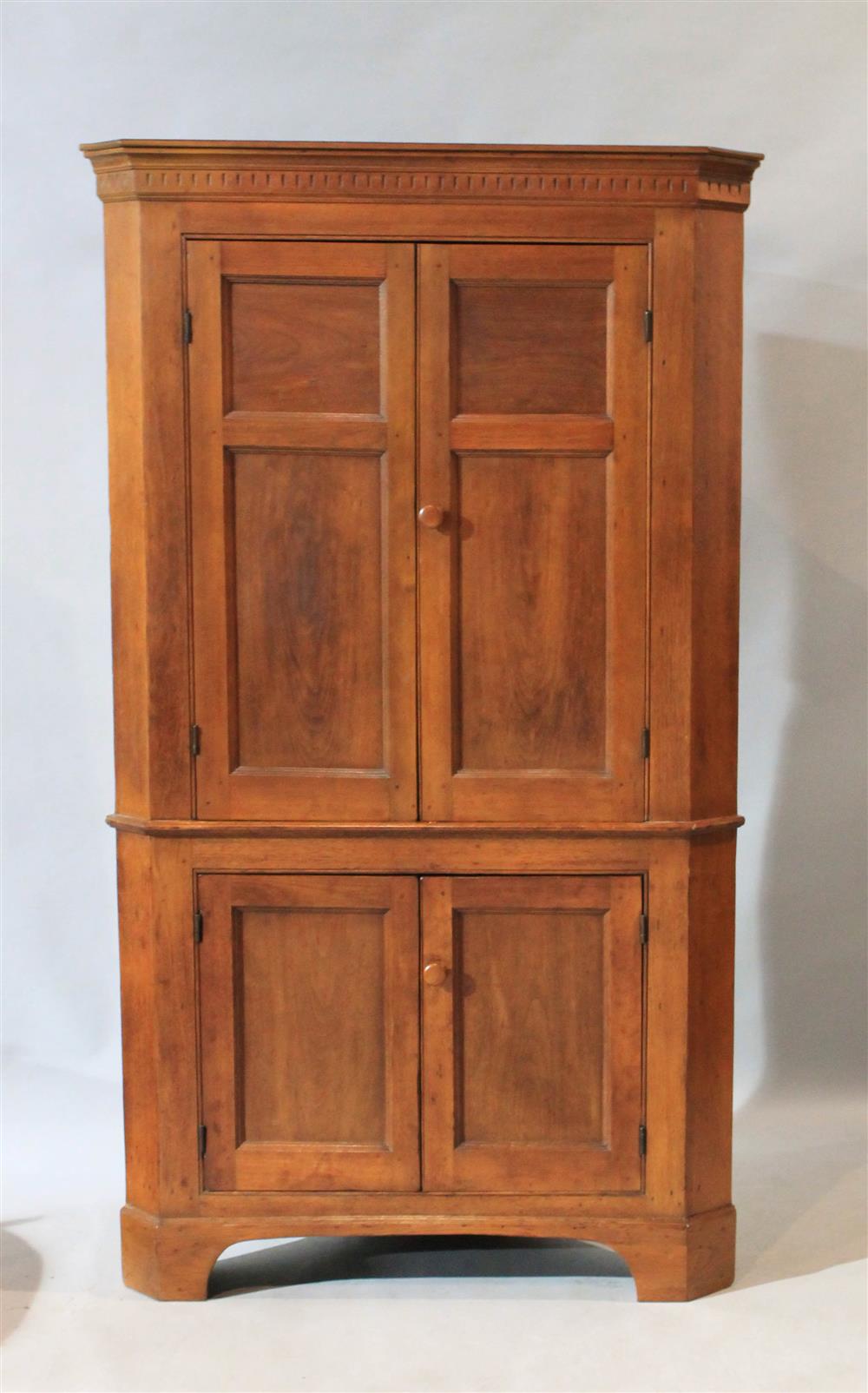 Appraisal: SOUTHERN WALNUT PANELED DOOR CORNER CUPBOARD ca having one piece