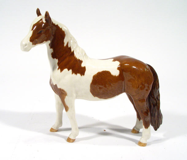 Appraisal: Hand painted Beswick brown and white pinto pony factory marks