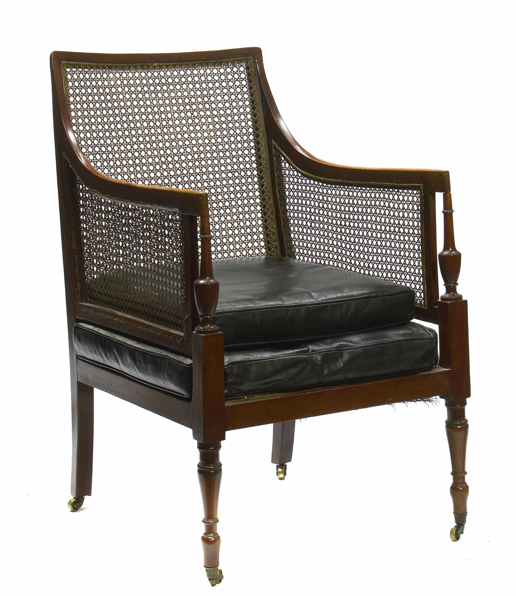 Appraisal: A Regency mahogany and cane paneled bergere height in width