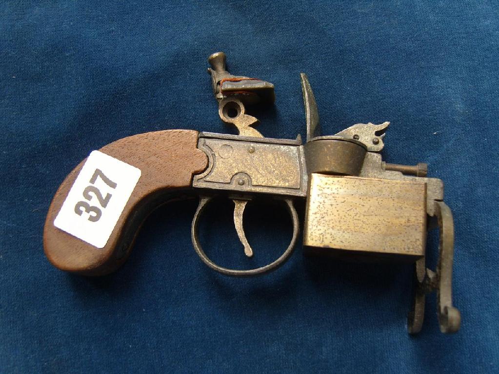 Appraisal: A cigarette lighter in the form of a flintlock pistol