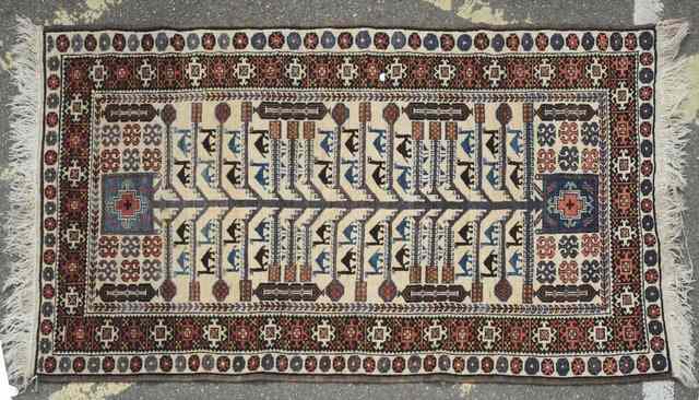 Appraisal: A BELOUCH BEIGE GROUND RUG decorated a central tree motif