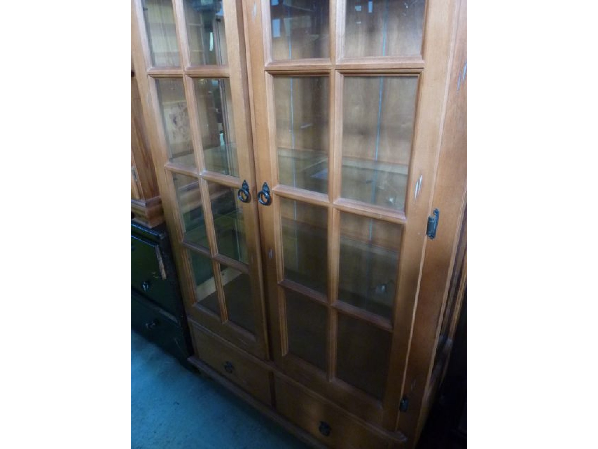 Appraisal: A contemporary freestanding display cabinet with distressed detail partially enclosed