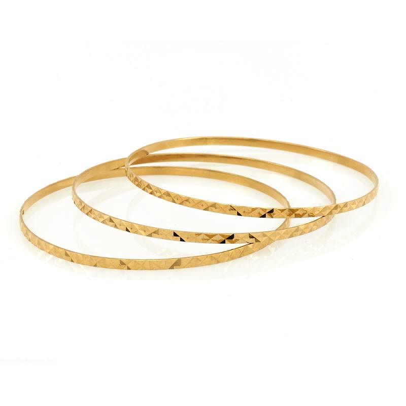 Appraisal: Three k Yellow gold bangle bracelets A set of three