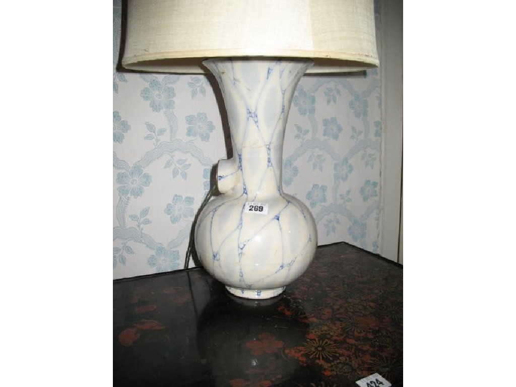 Appraisal: A PAIR OF POTTERY TABLE LAMPS with bulbous bodies and