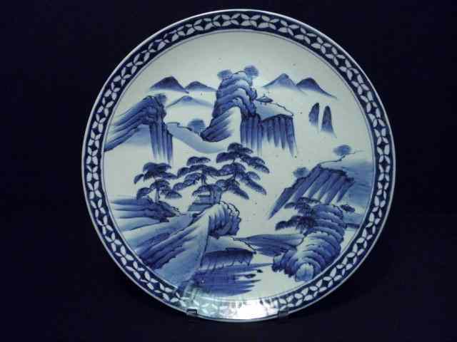 Appraisal: Large Arita blue and white charger Mountainous landscape scene and