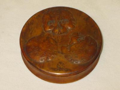 Appraisal: A FRENCH FRUITWOOD BOX of circular form the lid carved