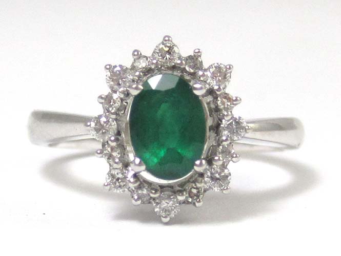 Appraisal: EMERALD DIAMOND AND FOURTEEN KARAT WHITE GOLD RING the oval-cut