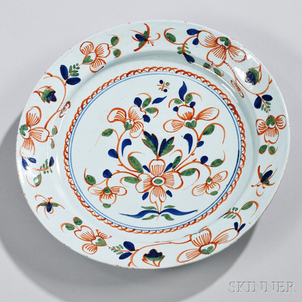 Appraisal: English Delft Polychrome Decorated Charger th century floral rim with