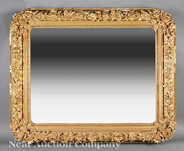 Appraisal: An American Rococo Carved Giltwood Mirror late th c beaded