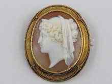 Appraisal: An antique carved shell cameo brooch with scratched signature verso