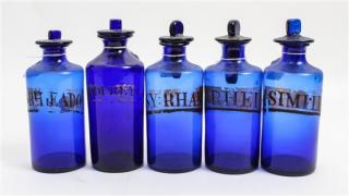 Appraisal: A Collection of Five Blue Glass Apothecary Bottles Height of