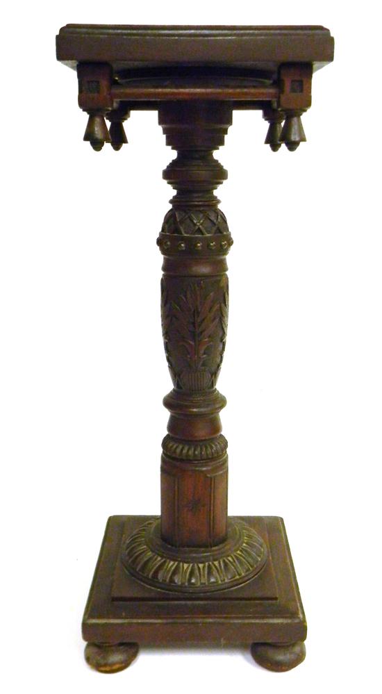 Appraisal: Victorian carved walnut pedestal square top pierced apron drop finials