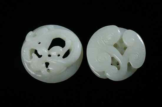 Appraisal: TWO CHINESE CELADON JADE CARVINGS OF DRAGON AND RUYI HEADS