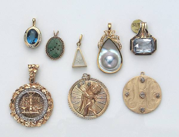 Appraisal: A collection of eight diamond gem-set and gold pendants gross