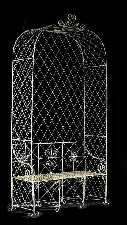 Appraisal: A WROUGHT IRON AND WIREWORK ARBOUR SEAT with arched top