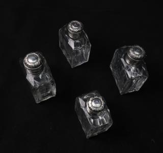 Appraisal: Four Crystal Bottles With Metal Caps Four crystal bottles mounted