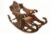 Appraisal: FANTASY ROCKING CHAIR - th C Italian oversized walnut fantasy