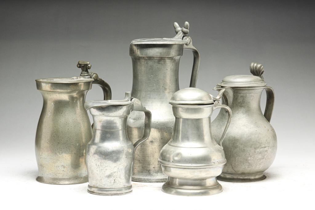 Appraisal: FIVE EUROPEAN PEWTER FLAGONS Nineteenth century One with shell thumb