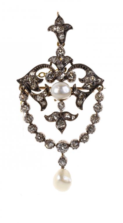 Appraisal: A DIAMOND AND BAROQUE PEARL ARTICULATED FESTOON BROOCH-PENDANT mounted in