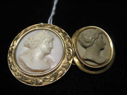 Appraisal: Two cameo pins one lava one shell both of women