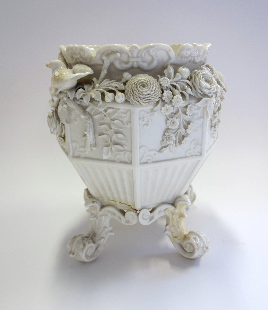 Appraisal: A Belleek porcelain jardiniere black painted mark floral encrusted decoration