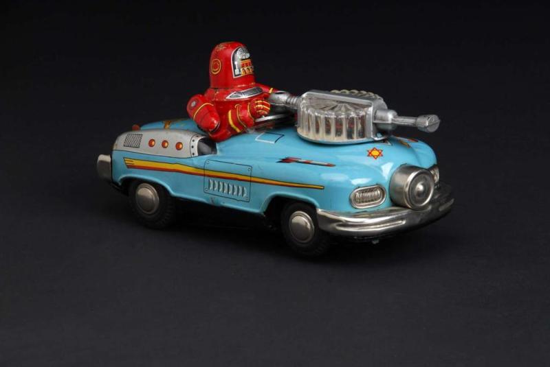 Appraisal: Robby in a Studebaker Toy Description Japanese Made by Nomura