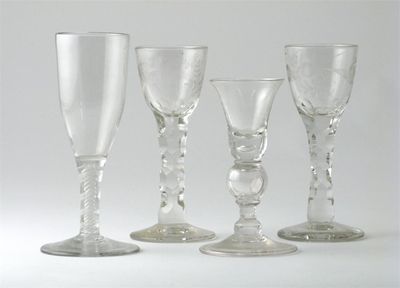 Appraisal: Four wine glasses two engraved with a bird and flowers