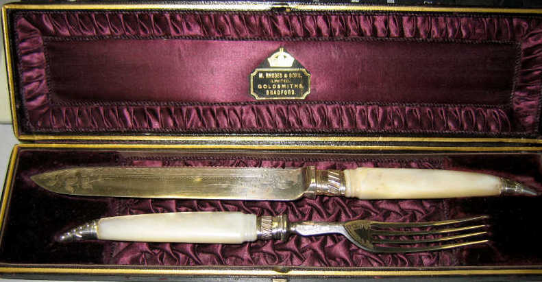 Appraisal: TWO-PIECE ENGLISH VICTORIAN CARVING SET Plated silver with mother of