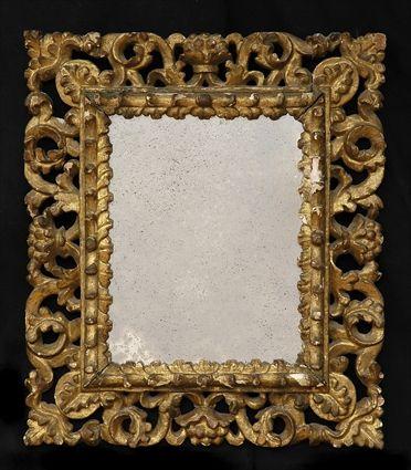 Appraisal: ITALIAN BAROQUE-STYLE CARVED GILTWOOD SMALL MIRROR The plate within tiered