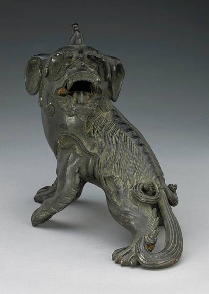 Appraisal: A cast bronze seated qilin th Century The mythical beast