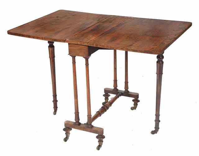 Appraisal: A VICTORIAN ROSEWOOD DROP LEAF SUTHERLAND TABLE on ring turned