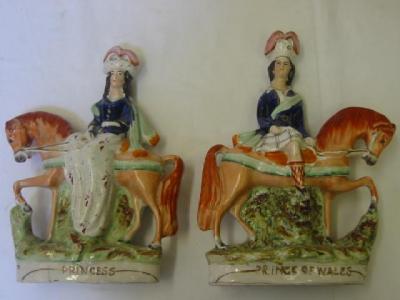 Appraisal: A PAIR OF STAFFORDSHIRE POTTERY FIGURES modelled as the Prince