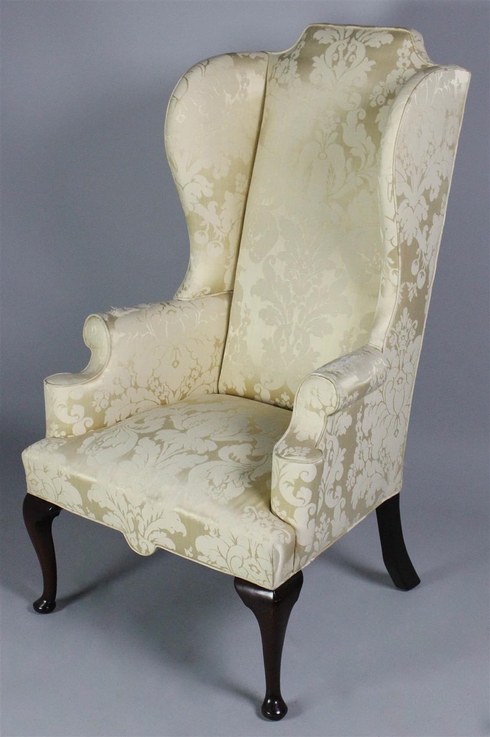 Appraisal: QUEEN ANNE STYLE MAHOGANY WING CHAIR having an arched crest