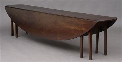 Appraisal: ENGLISH MAHOGANY LARGE HUNT TABLE The long top with bowed