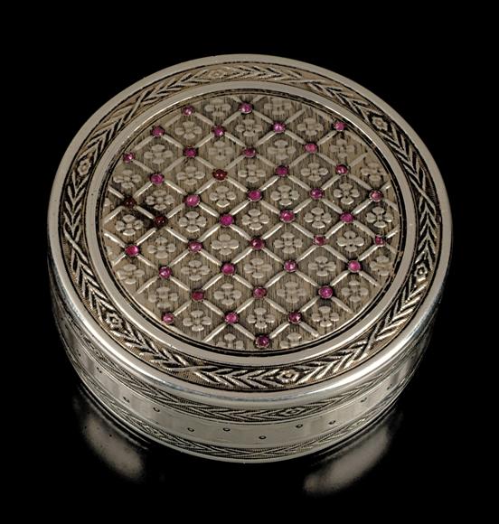 Appraisal: A French silver coloured circular box by Leon Smets large