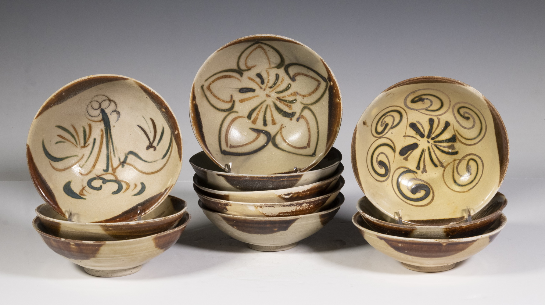 Appraisal: CHINESE TANG DYNASTY CHANGSHA GLAZED DISHES Having similar decoration of