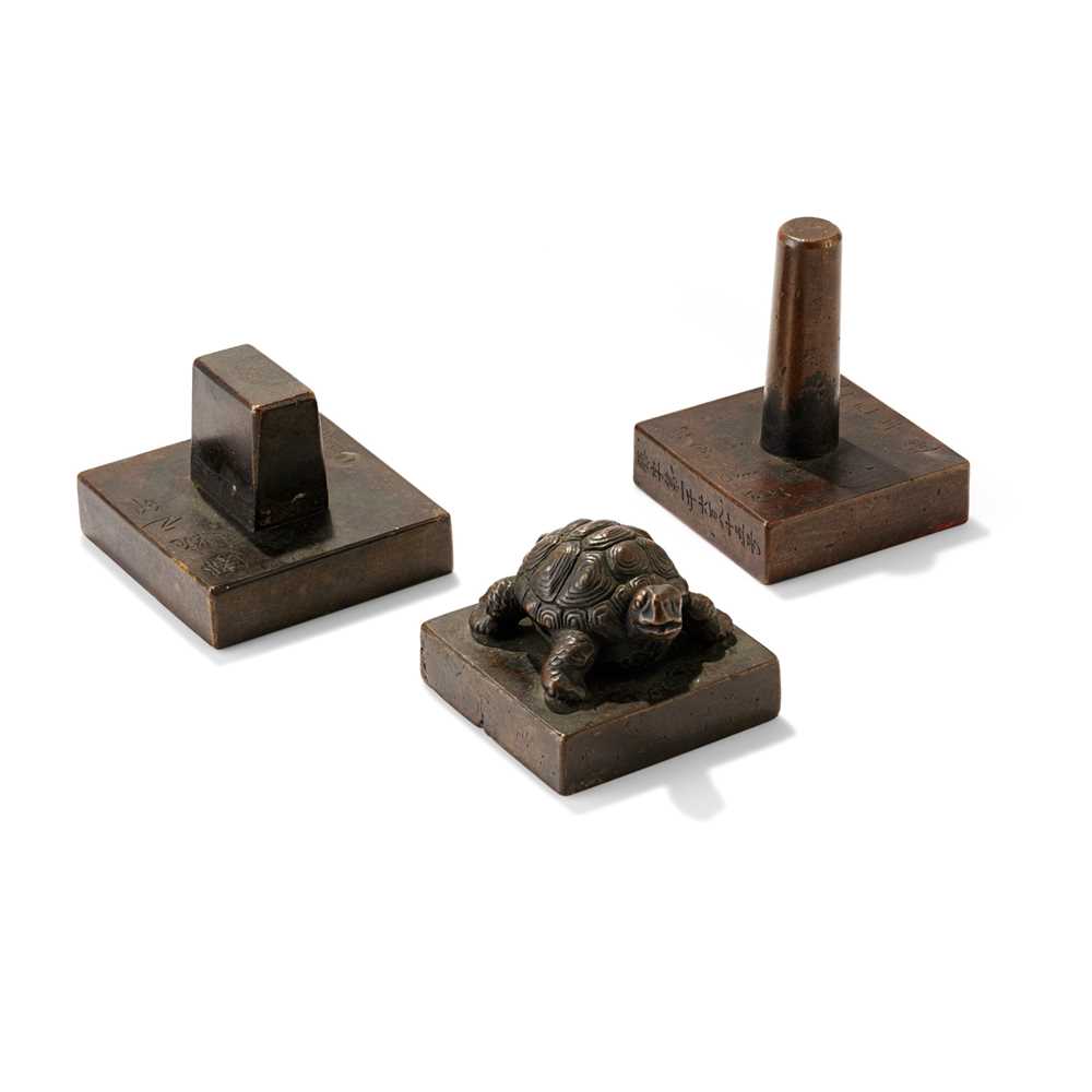 Appraisal: GROUP OF THREE BRONZE SQUARE SEALS comprising one cast with