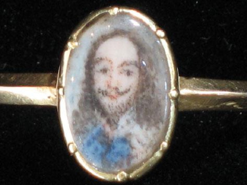 Appraisal: A CAROLINE MEMORIAL RING the bezel aperture set with a