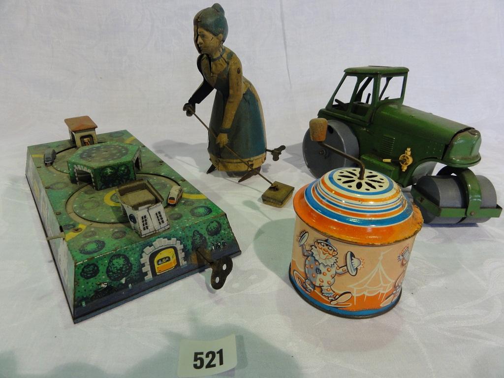 Appraisal: A small collection of tin toys including a clockwork broom