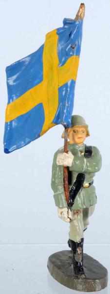 Appraisal: Elastolin cm Swedish Flag-Bearer Composition flag of Sweden This figure